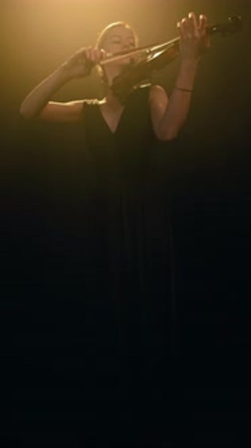 Woman Performing Classical Music on Violin