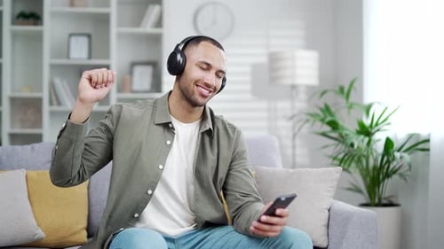 Man Enjoys Music and Dances at Home