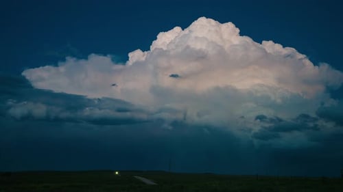 Lightning Storm Clouds Over Rural Grassy Landscape