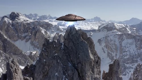 Flying Saucer Ufo Hovering Above The Alps Peak, Aerial