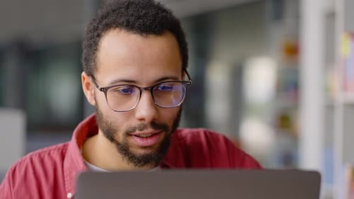 Man Video Conferencing on Laptop Close Up