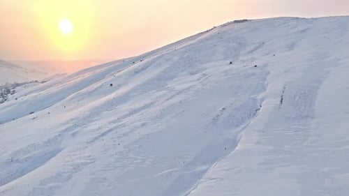 Sunny Winter Landscape on Snow Covered Mountain Slopes