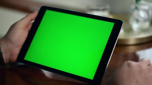 Closeup Chroma Key Tablet in Businessman Hands. Manager Hold Mockup Device Analyzing