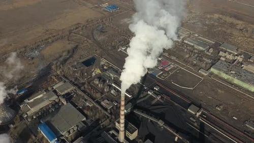 Aerial View of Thermal Power Plant Drone Flies Over Chimney Smoke Pipes and Cooling Towers of