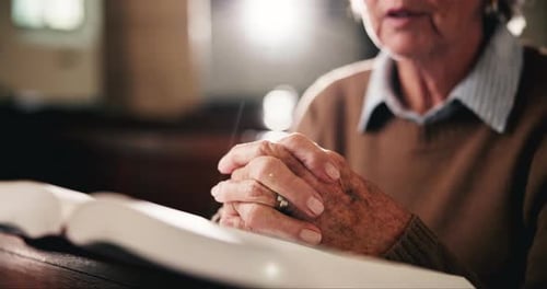 Bible, prayer and hands of old woman in church with faith, gratitude or spiritual respect