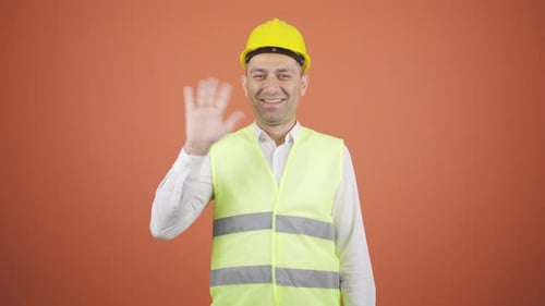 Engineer waving at camera.
