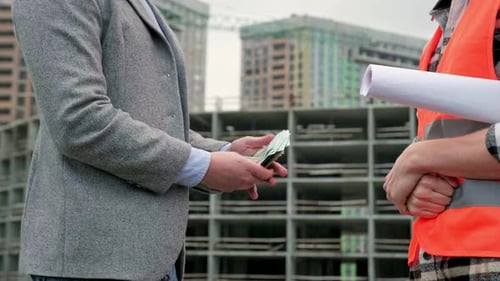 Business Deal at Construction Site