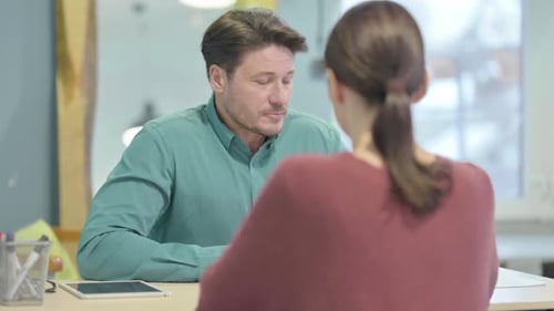 Creative Man Talking with Employee in Office