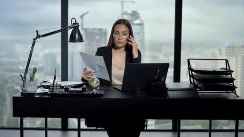 Confident Businesswoman Talking Smartphone in Office Interior. Female Professional Looking at Busine