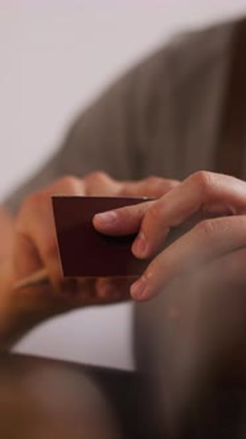 Man Applies Glue Onto Leather Details Edge at Workplace