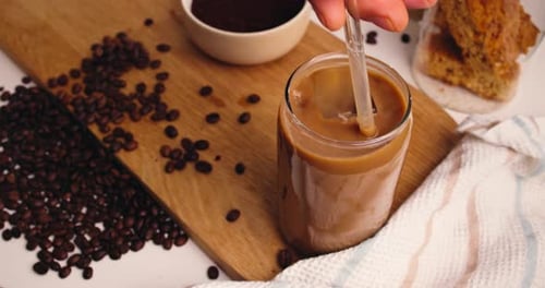 Iced Coffee Refreshment on Wooden Cutting Board