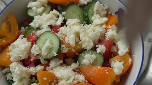 Fresh salad preparation with crumbled feta cheese topping