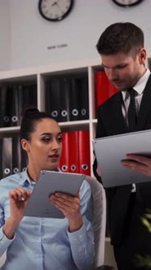 Vertical of Business People in Office Working with Digital Pad