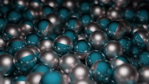 Colored metal balls move in stream