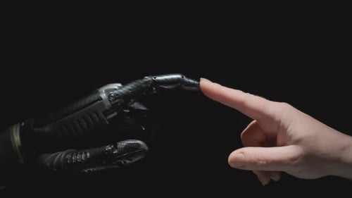Human Finger Touches Futuristic Robotic Hand