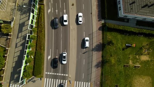 Aerial - following moving forward cars on highway road near Gdynia Witomino forest, Poland