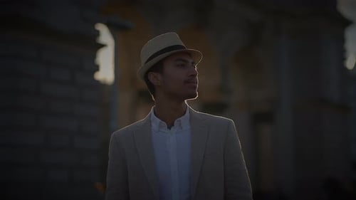 Fashionable Young Handsome Man Wearing a Hat and Casual Clothes in the City