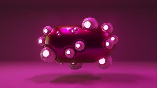 Metallic Purple Object with White Spheres on Its Surface is Rotating Slowly Illuminated By a Bright