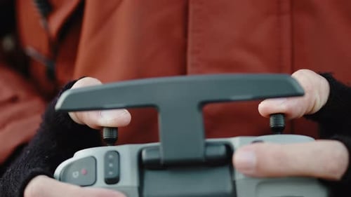Hands Operating Drone Controller Close Up