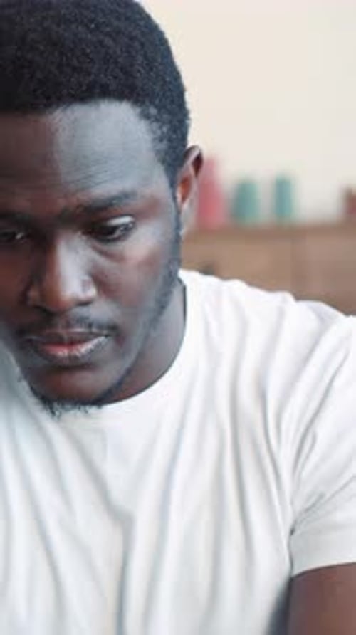 Distressed Young Man Looks Sad Indoors