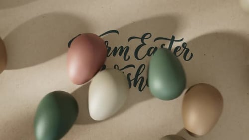 Warm Easter Wishes Calligraphy with Rotating Decorative Eggs
