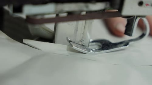 Closeup of Sewing Machine Foot on Fabric Sewing Machine Foot and Needle in Action on Cloth Concept