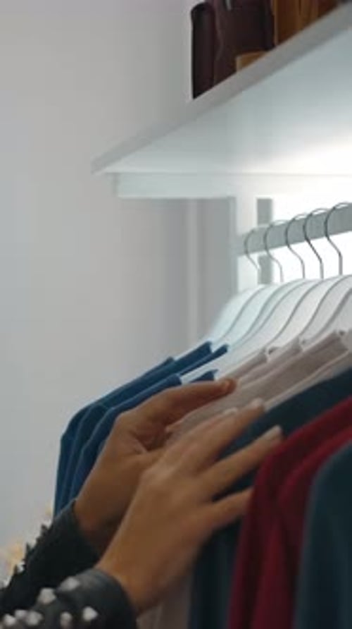Young Woman Shopping For Clothes in a Boutique