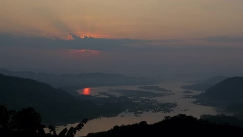 Time lapse video of dramatic from dawn until sunrise over a river in a sunny day.