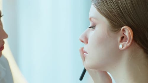 Makeup Artist Work in Her Beauty Studio Portrait of Woman Applying By Professional Make Up Master