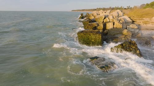 Beautiful aerial establishing view of Karosta (Liepaja) concrete coast fortification ruins, vibrant