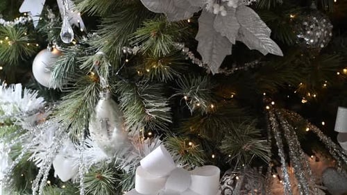 Elegant Christmas Tree Decorated with Silver and White