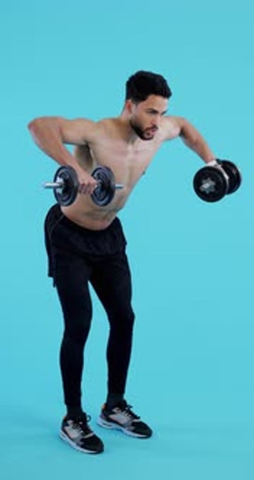 Workout, gym and man with dumbbell for fitness, training and exercise with healthy mindset and body