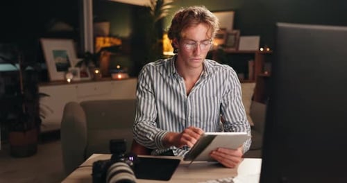 Night, office and man with tablet for editing, creative photography and software for online design