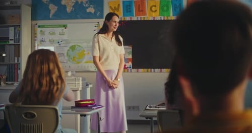 Female Teacher Calling Young Student to the Board Primary School Girl Showcasing Knowledge of