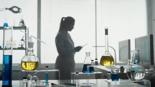 Laboratory of Modern Medical Research A Female Researcher Uses a Tablet in a Laboratory A Woman