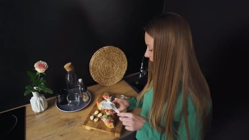 Cute Nice Girl Blonde Woman in the Kitchen Preparing Breakfast Making Sandwiches Top View