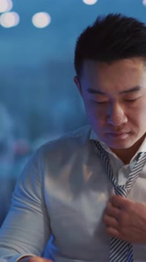 Frustrated Young Adult Working Overtime in Office