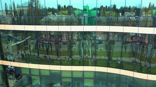 Windows of skyscraper building. Modern office skyscraper with glass windows and reflection