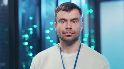 An IT Professional Inspects Servers in a Modern Data Center