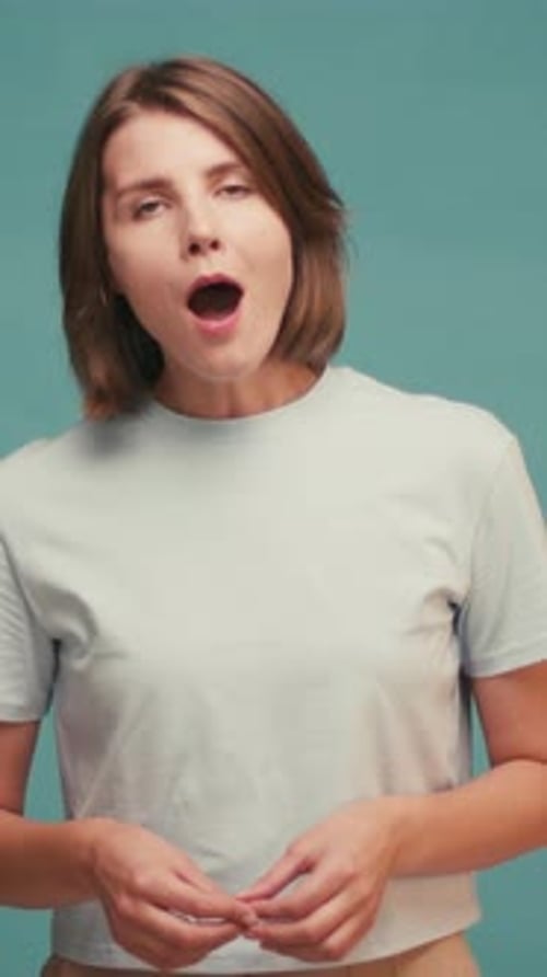 Woman Reacts with Surprise and Joy Indoors