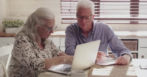 Senior couple, computer and planning for home investment, budget or retirement research
