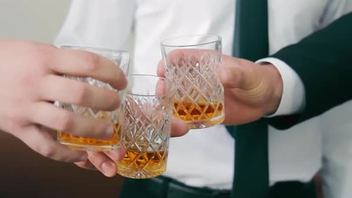 Businessmen Toasting Success with Drinks