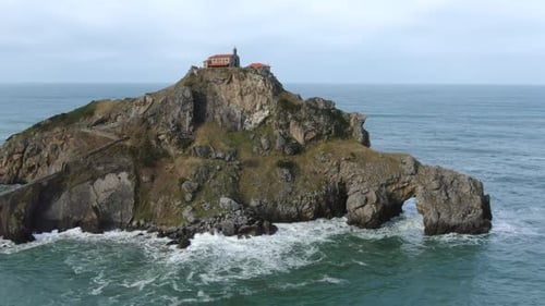 Aerial shot Gaztelugache is an islet in the Vizcaya town of Bermeo, Pais Vasco, Spain.