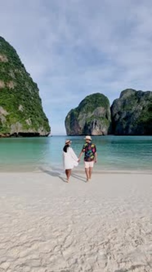 Strolling Hand in Hand on the Serene Beaches of Koh Phi Phi in Thailand