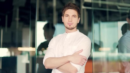 Confident Young Man in White Shirt in Office