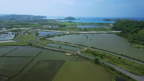Aerial Coastline Approach Over Farmland And Headland