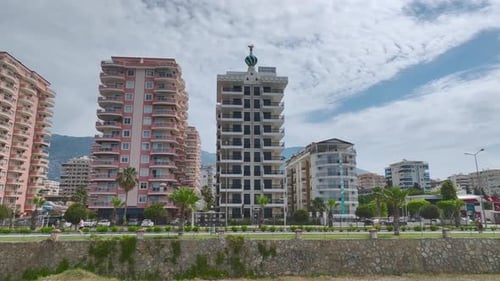 Aerial View Luxury Complex By Azure Sea and Majestic Mountains