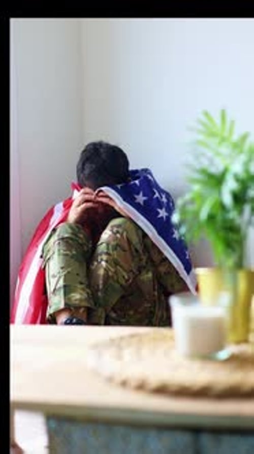 vertical Young veteran suffering from post-traumatic stress disorder