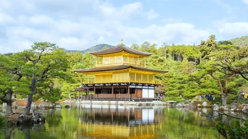 Kinkakuji temple on a pond, Kyoto, Japan. Time lapse video in autumn season on a sunny day.