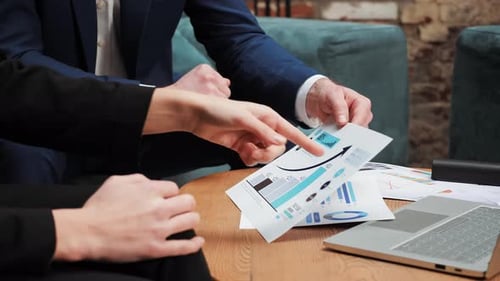 Business Professionals Discussing Data in an Office